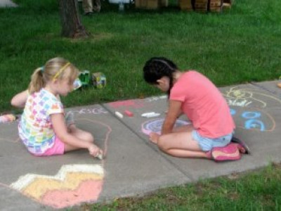 GirlsDrawingOnSidewalk