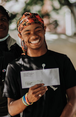 Boy receiving a paycheck